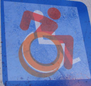 Accessible Icon Project's sticker laid over the traditional ISA logo